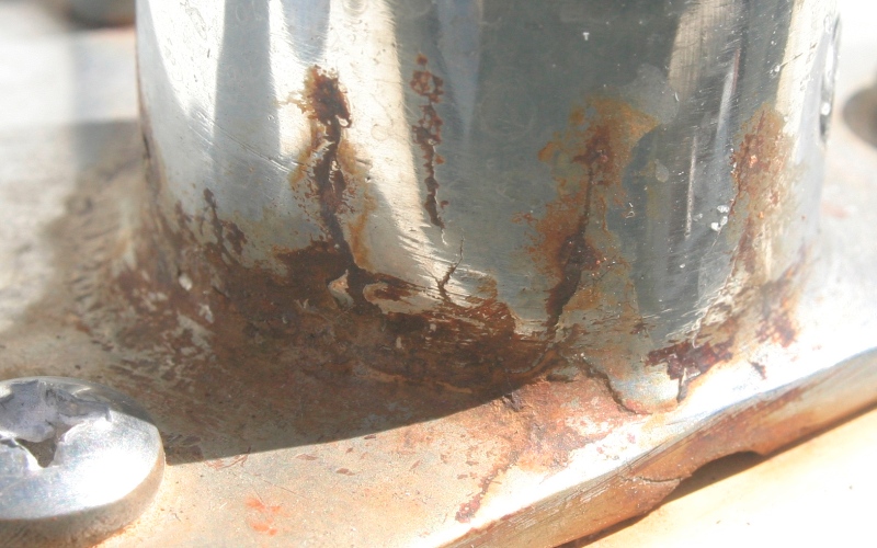 Crevice corrosion cracks extending from weld in stanchion base